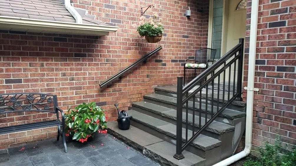 Black aluminum picket porch railing on stone steps Mississauga installation