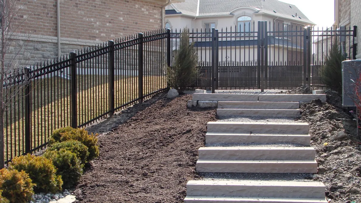 Black aluminum stair railing brick home Etobicoke installation